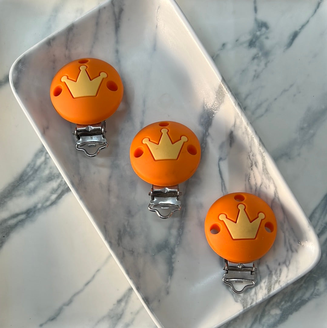 Broche bebé naranja